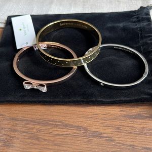 Set of 3 Kate Spade bangles. Silver, Rose Gold and gold black/white polka dots.